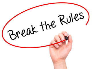 Man Hand writing Break the Rules with black marker on visual scr