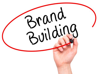 Man Hand writing Brand Building with black marker on visual scre