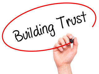 Man Hand writing Building Trust with black marker on visual scre