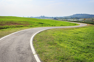 Fototapeta na wymiar Outdoor asphalt road, exercise bike paths on the hill