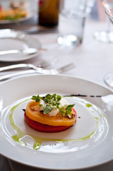 Caprese Salad on plate with olive oil drizzle