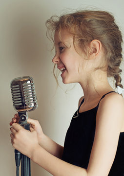 Pretty little girl with the retro microphone.