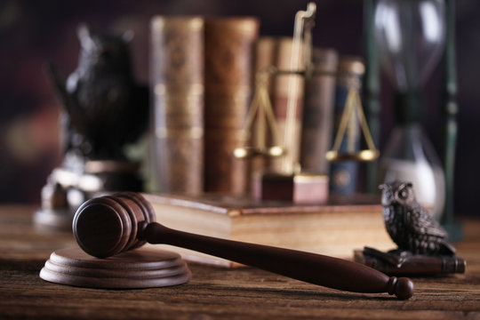 Law theme, mallet of judge, wooden gavel, books