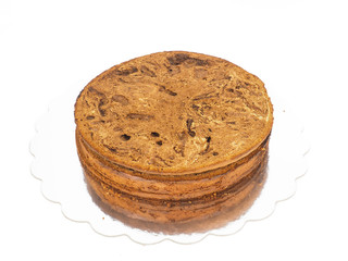 Closeup of freshly made chocolate cake base on silver mirror pla