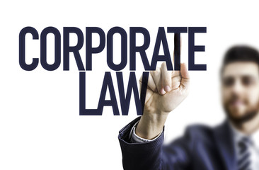 Business man pointing the text: Corporate Law