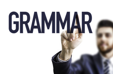 Business man pointing the text: Grammar