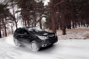 Cercles muraux Voitures rapides Black car speed drive on off road at winter daytime