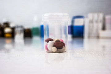 Drugs in a measuring cylinder