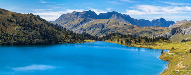 Panorama view of Engstlensee lake and the Alps