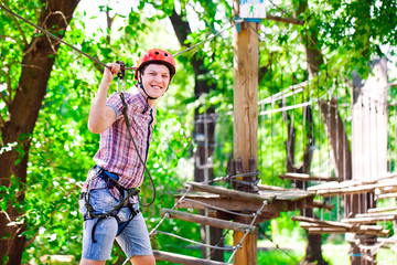 adventure climbing high wire park - people on course in mountain