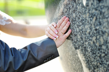 hands of groom and bride with golden ring