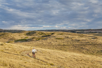 Fototapeta na wymiar moutain biking in a rolling prairie