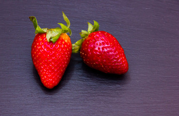 Strawberries on top in slate top views