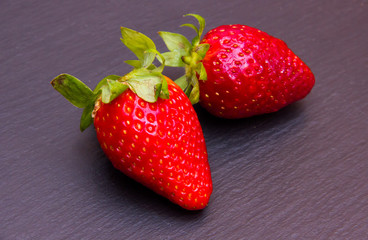 Strawberries on top in slate seen up close