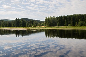 Fototapeta na wymiar Hutsky pond in Novohradske mountains, south Bohemia, Czech republic