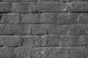 The paint on the masonry