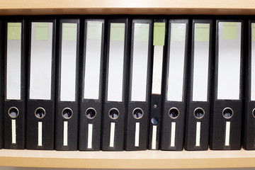 old files for documents on a book shelf at office