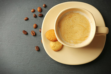 Cup of coffee on gray background