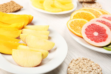 Fruits on light wooden background. healthy eating concept.