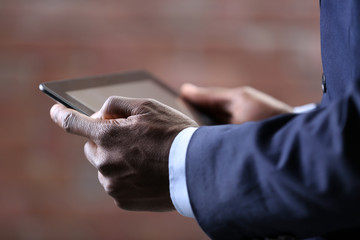 Male hands with tablet, close up