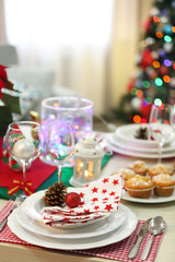 Christmas table setting on light room background