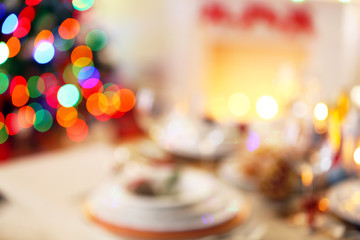 Naklejka na ściany i meble Christmas table setting with holiday decorations on fireplace background