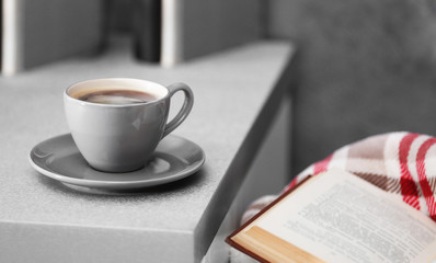 Cup of coffee on the kitchen table, close up