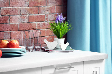 Beautiful fresh flower on kitchen table, close up