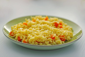 Stewed rice with a carrot on a , close up