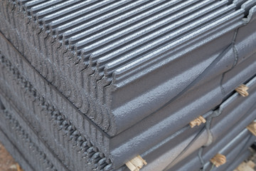 stack of concrete roof tile (gray color) at construction site
