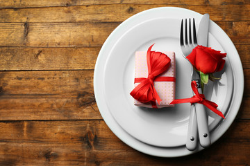 Festive table setting for Valentines Day on wooden table background