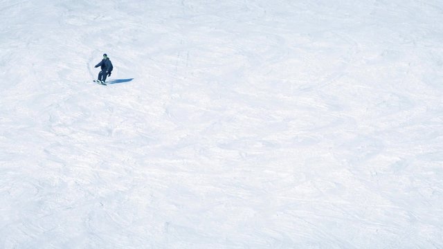 Snowboarder On Mountainside