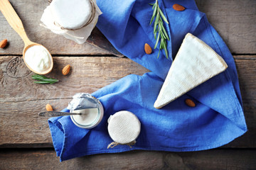 Set of dairy products on wooden table, top view