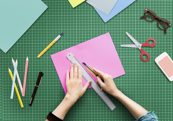 Woman Cutting Paper Stationery Workstation Concept