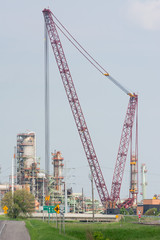 Fototapeta na wymiar Super Large Crane working on an Oil Field Refinery