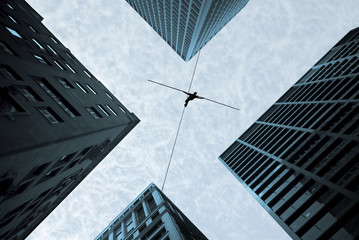 Tightrope walker concept of risk taking and challenge - obrazy, fototapety, plakaty