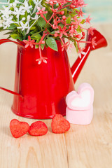 Heart shape with red watering can.Still life of love
