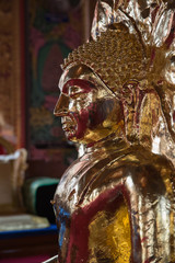 golden buddha statue in buddhism church temple