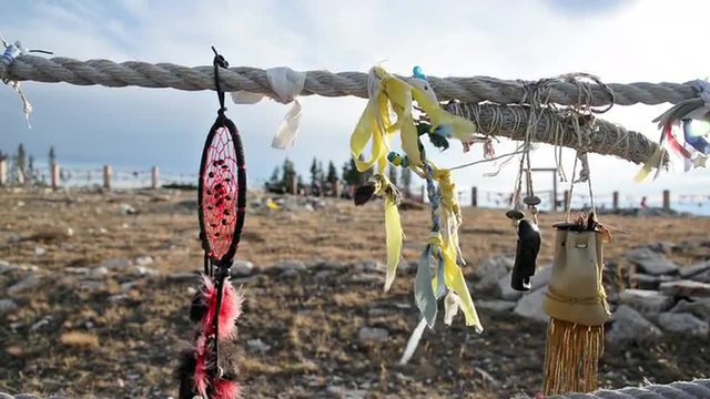 Red dreamcatcher blowing in the wind at Medicine Wheel National Historic Landmark in Wyoming