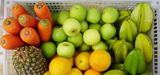 Crate of fresh fruit and vegetable for juicing