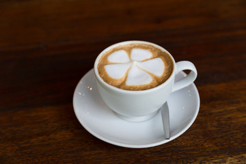 cup of cappuccino coffee with flower latte art