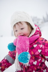 little girl have fun at snowy winter day
