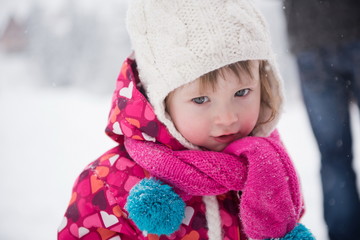 little girl have fun at snowy winter day