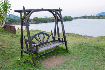 Wooden bench on side of Lake,Thailand