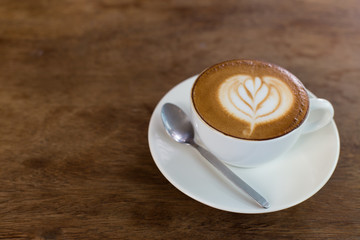 Hot art Latte Coffee in the table