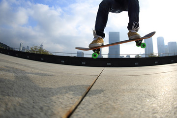 skateboarder skateboarding at city