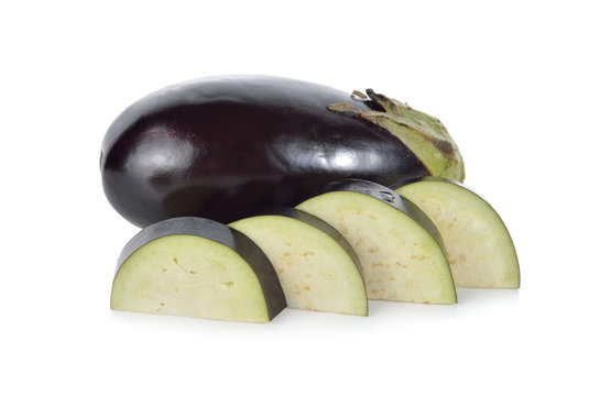 whole and sliced eggplant on white background