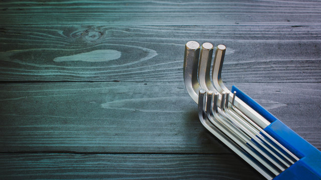 old Alen or Hollow set-screw Wrench on wooden background