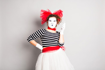 Woman mime  talking on her cell phone