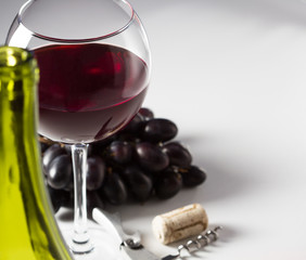 Glass of red wine and grape